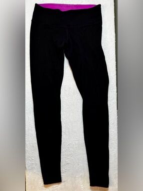 Lululemon Medium Black Thick Leggings with pink inside and small logo on leg